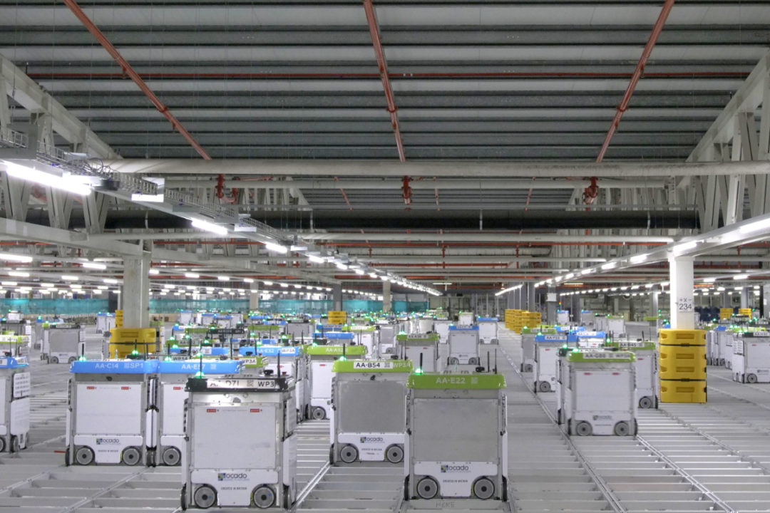 Robots at a Kroger, Ocado distribution center