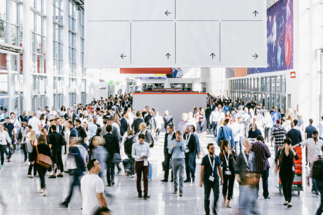 Crowd of people walking on a trade show