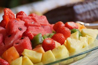pineapple-watermelon-strawberries-kiwi-cut-on-serving-bowl