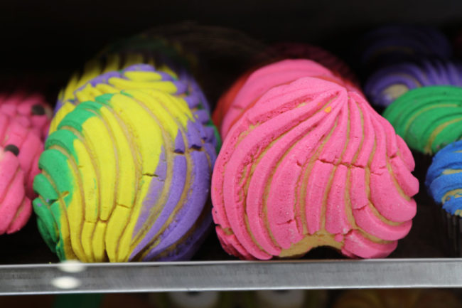 colorful-bread-on-a-shelf