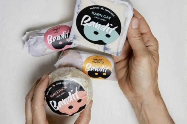 hands-holding-Bandit-vegan-cheese-packages