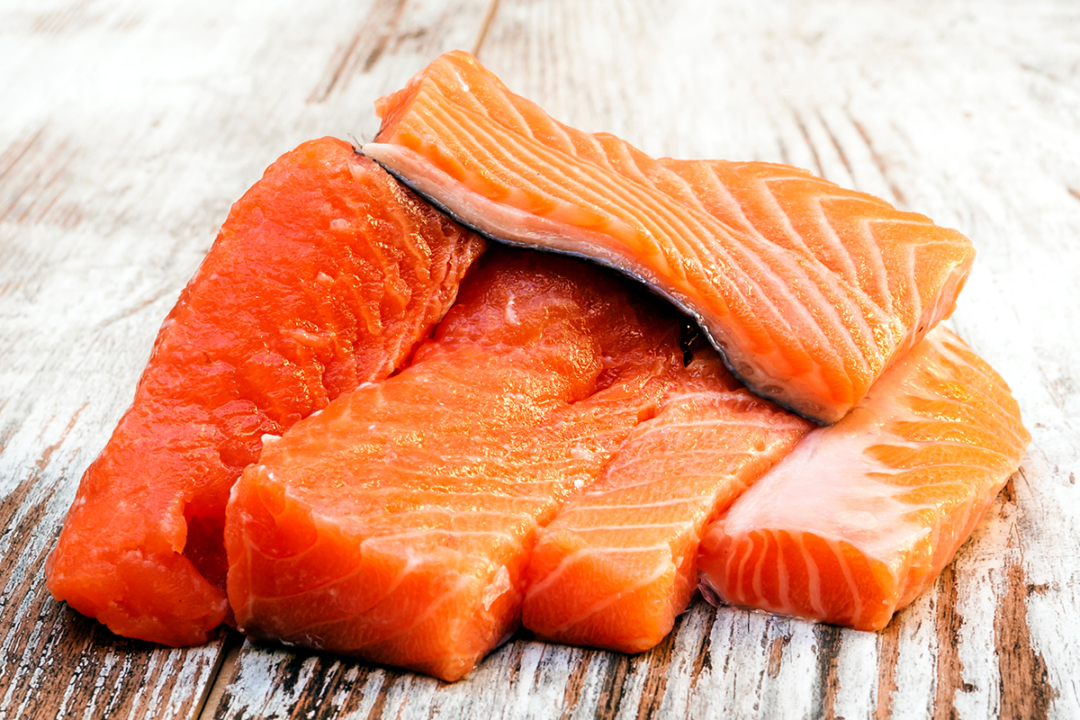 pieces-of-fresh-sockeye-salmon-on-gray-wooden-background