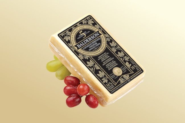 Balderson-5-year-old-aged-cheddar-with-grapes-on-gold-background