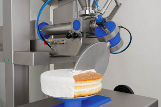 bakon equipment frosting a cake