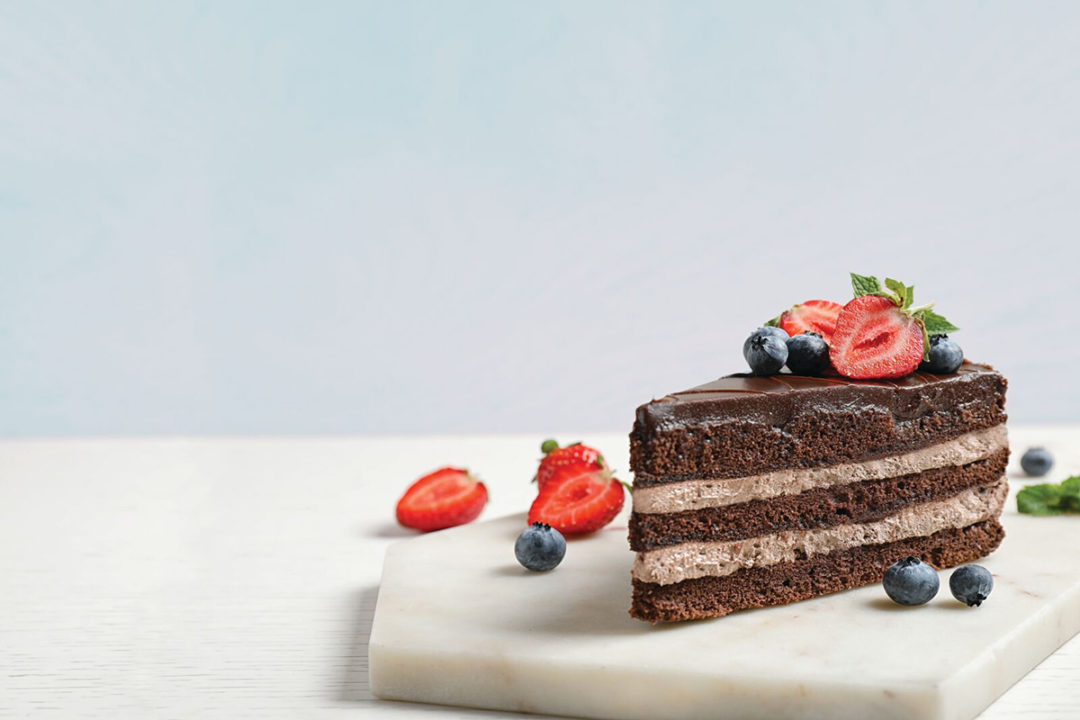 ardent mills gluten-free chocolate cake with berries on top