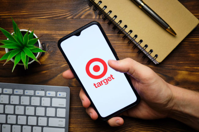 hand holding a smart phone showing the Target logo