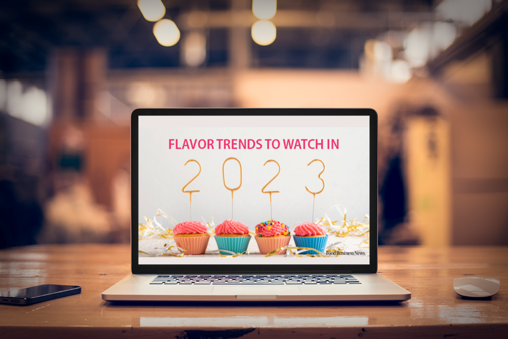 laptop on a table with an image that says "flavor trends to watch in 2023"