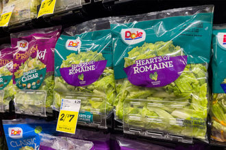 Dole fresh chopped lettuce in bags on shelf