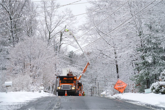 truck fixing power line in a snow storm