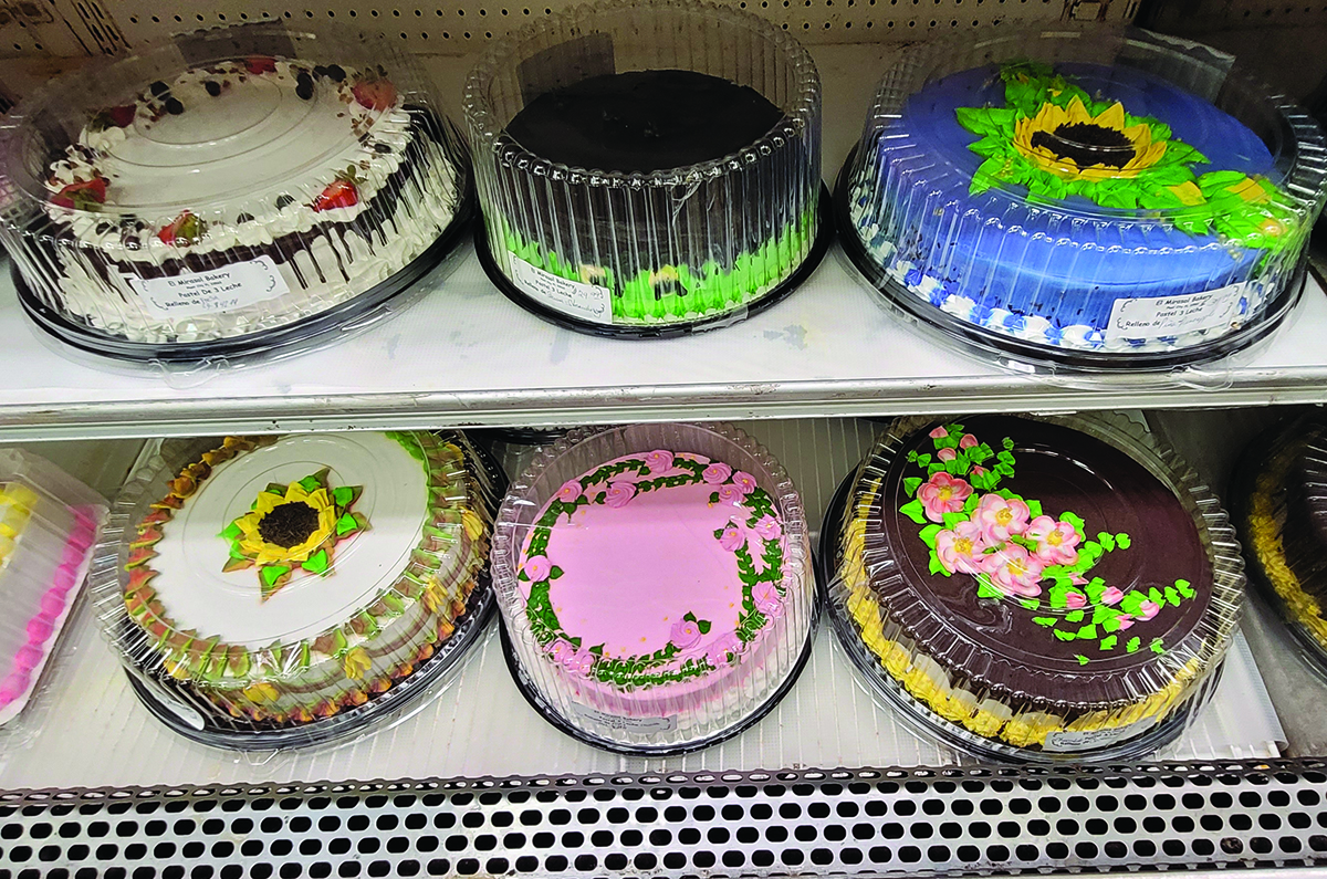 decorated cakes on supermarket shelves