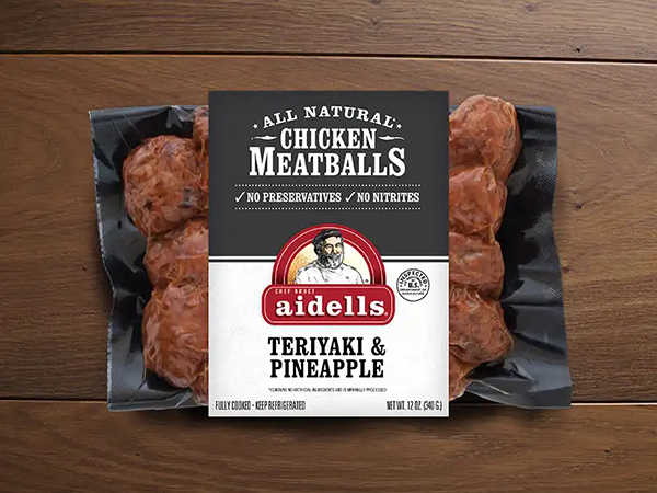 aidells sausage in packaging on wooden background