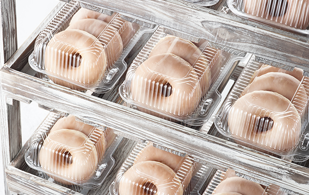 glazed donuts in plastic boxes