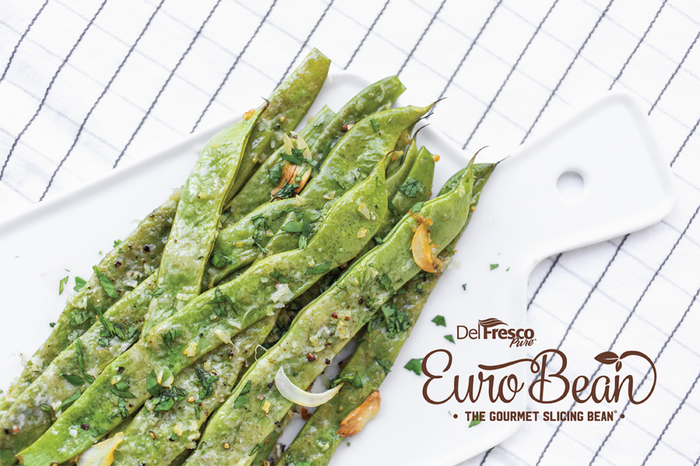 green beans on a white cutting board