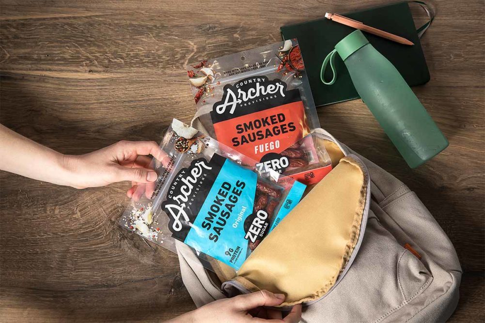 Country Archer smoked sausages in package in a backpack