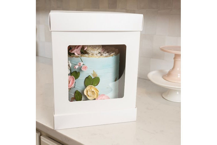 white box with transparent window to show a blue cake