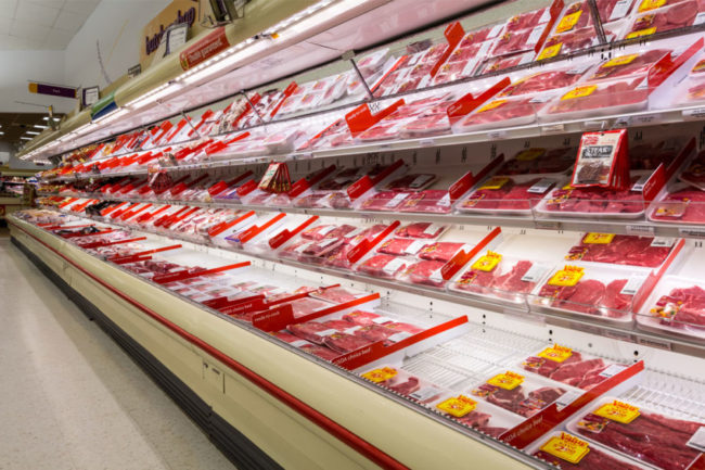 grocery store shelves of packaged meat