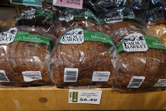 loaves of Farm to Market bread at grocery store