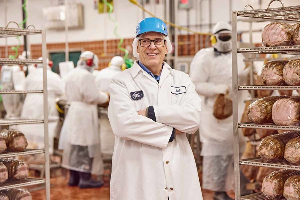 Robert Seaver in meat plant wearing safety gear