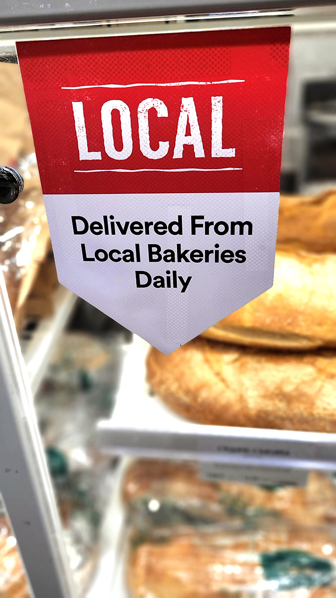 whole foods fresh local bakery sign