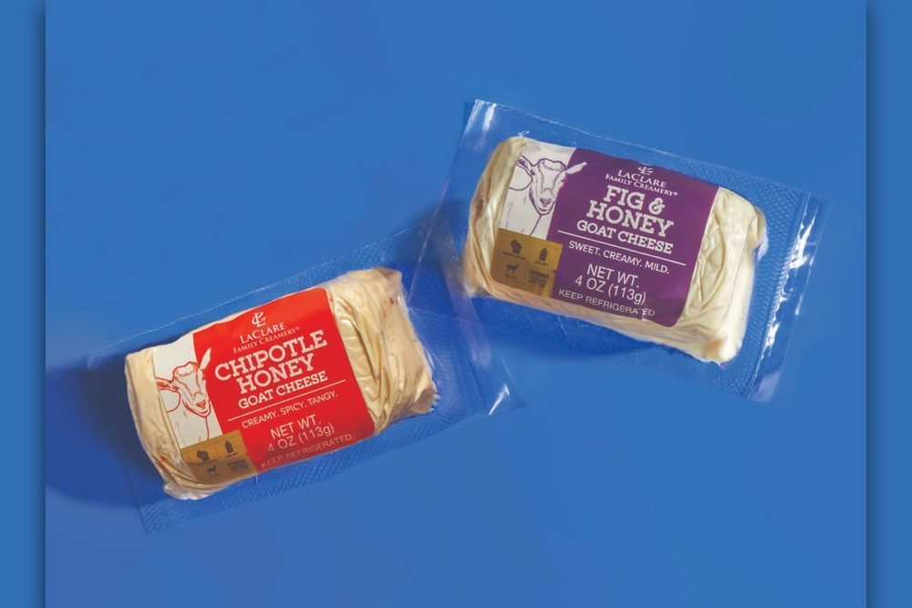 Two of LaClare Creamery cheeses in packaging on a blue background