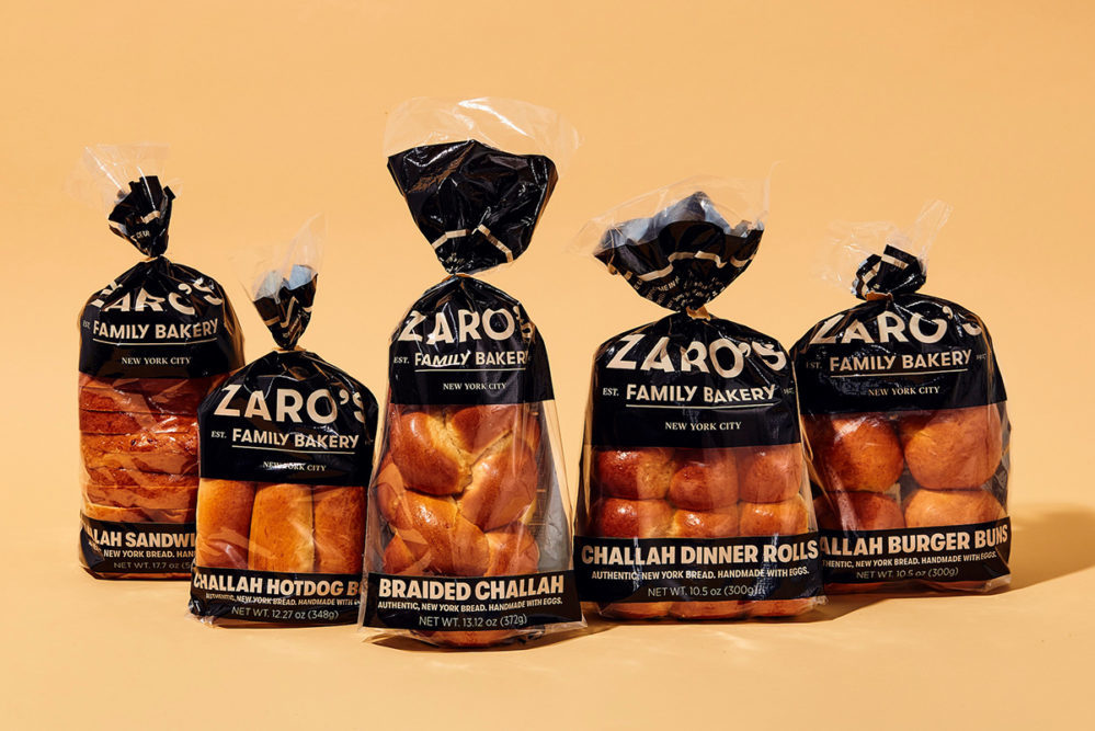 Zaro's Challah Collection in packaging on an orange background