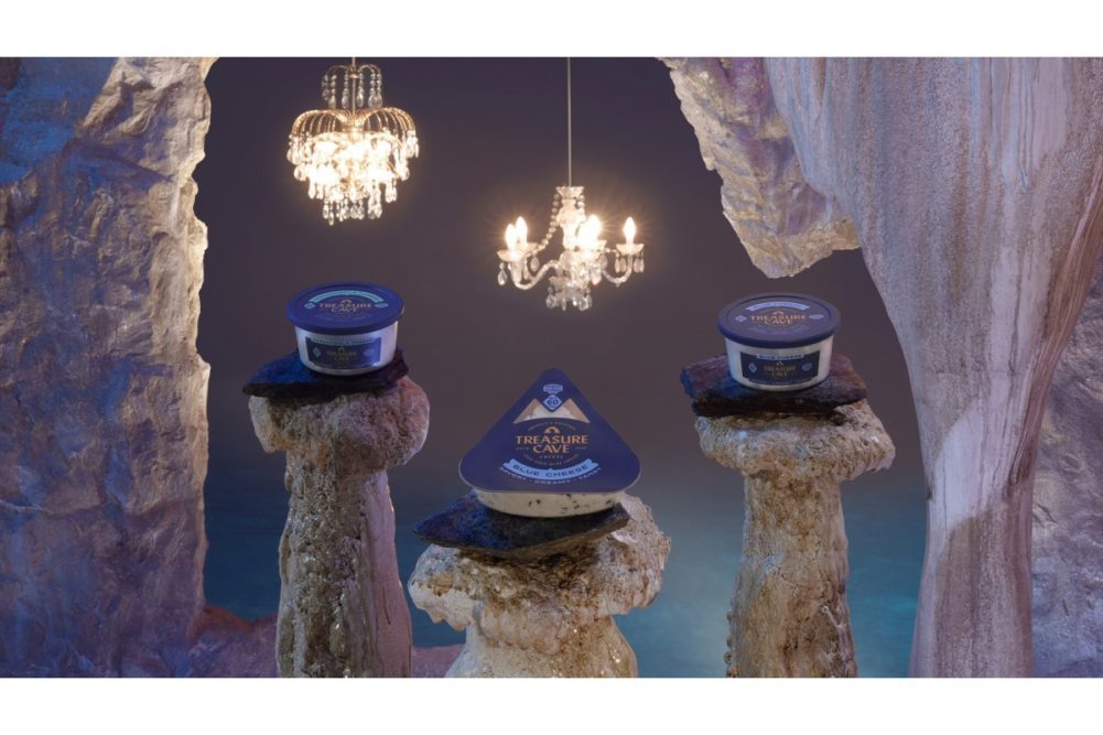 three packages of Saputo cheese in a cave with fancy overhead lights
