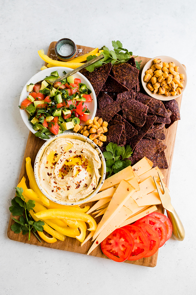 colorful charcuterie board with hummus