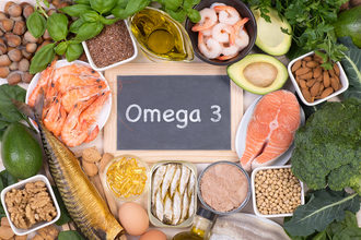chalkboard that says "omega 3" with healthy foods around it