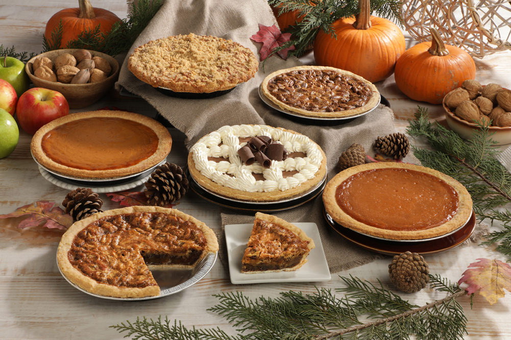variety of holiday pies with pumpkins