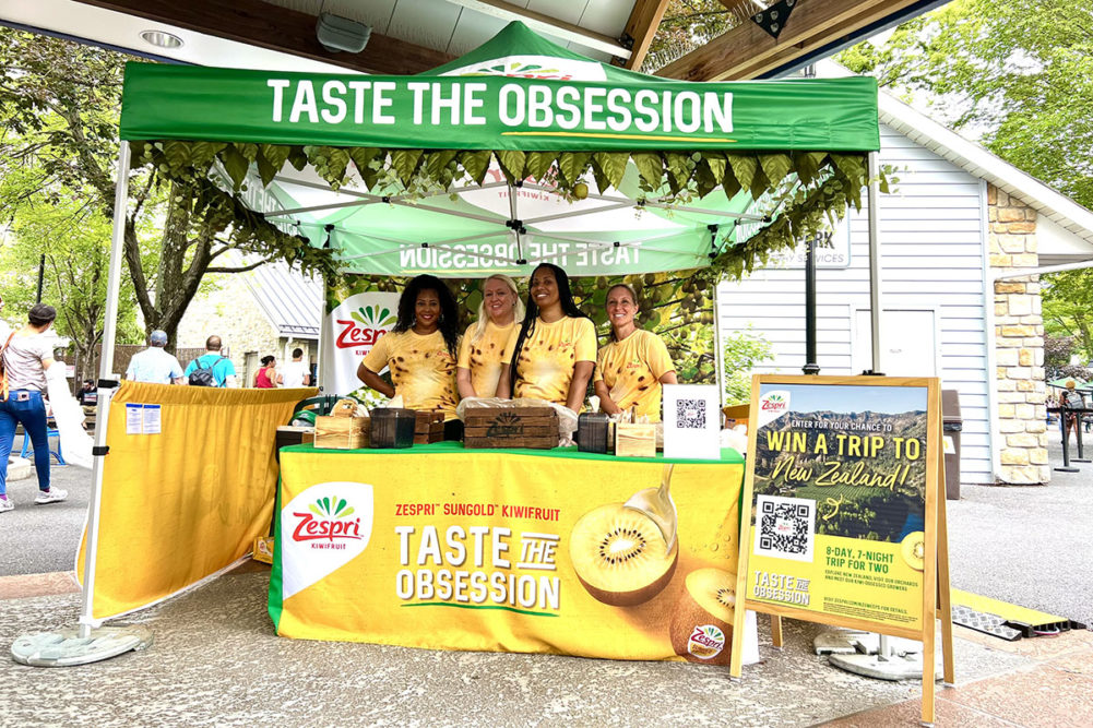 Zespri "taste the obsession" booth at an outdoor event