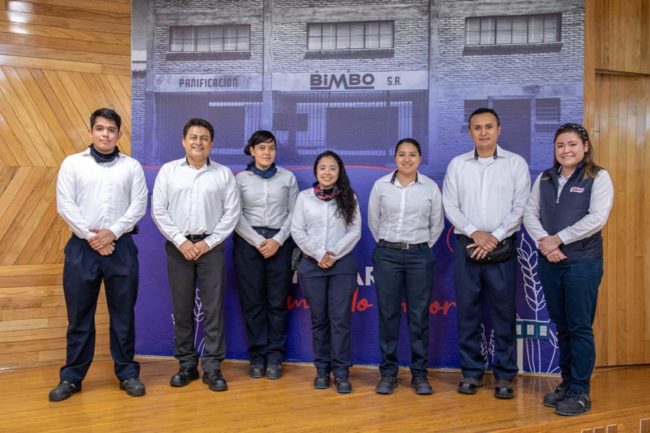 team of Grupo Bimbo employees in matching uniforms