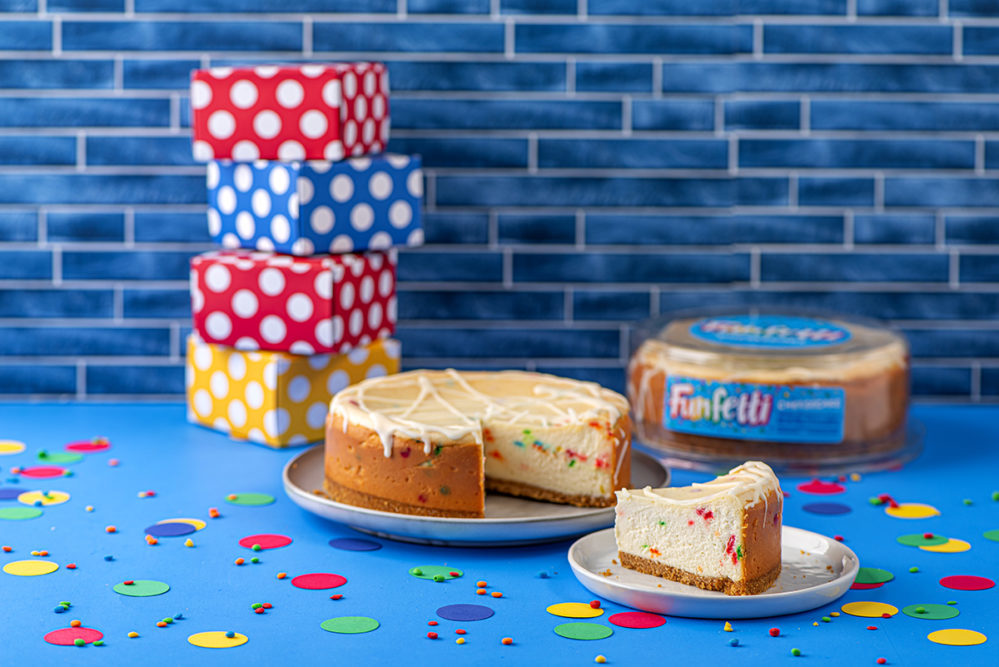 Rich Products Funfetti cheesecake next to wrapped birthday gifts