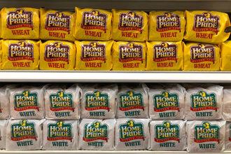 Home Pride (Flowers Foods) loaves of bread on grocery store shelf