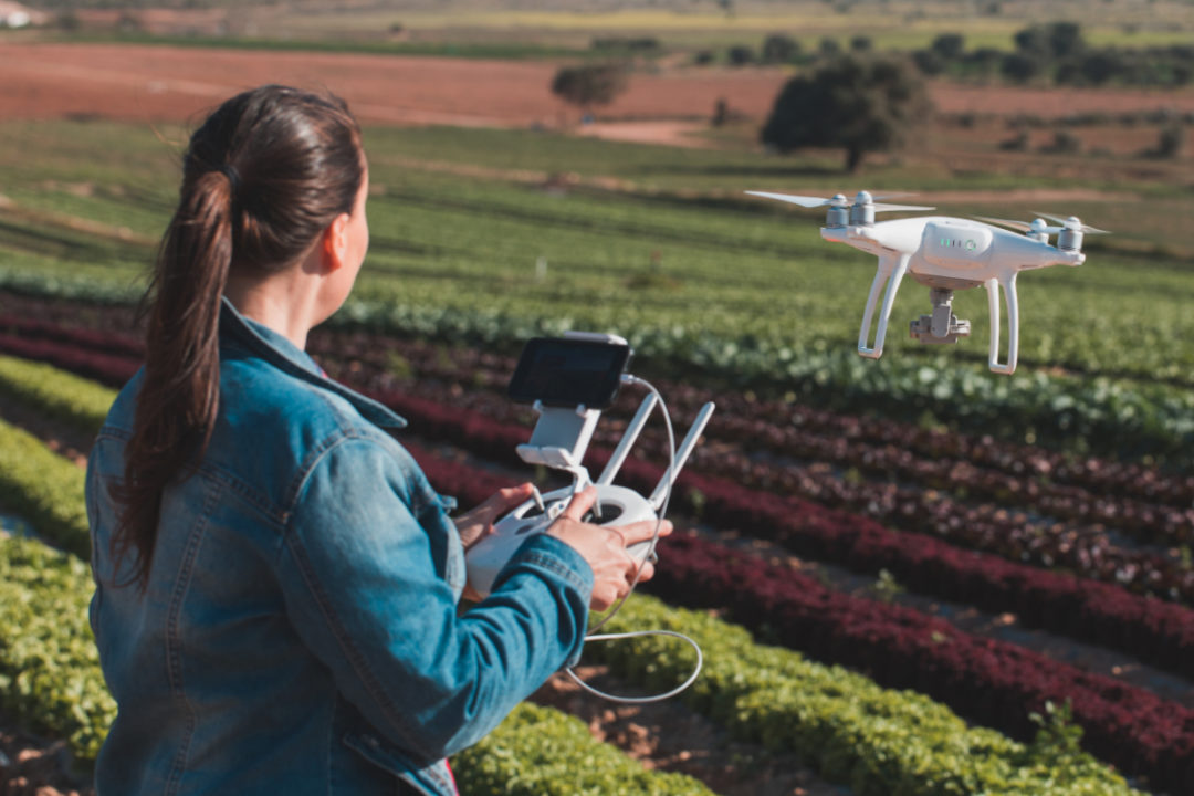 Farmer driving AI agriculture drone